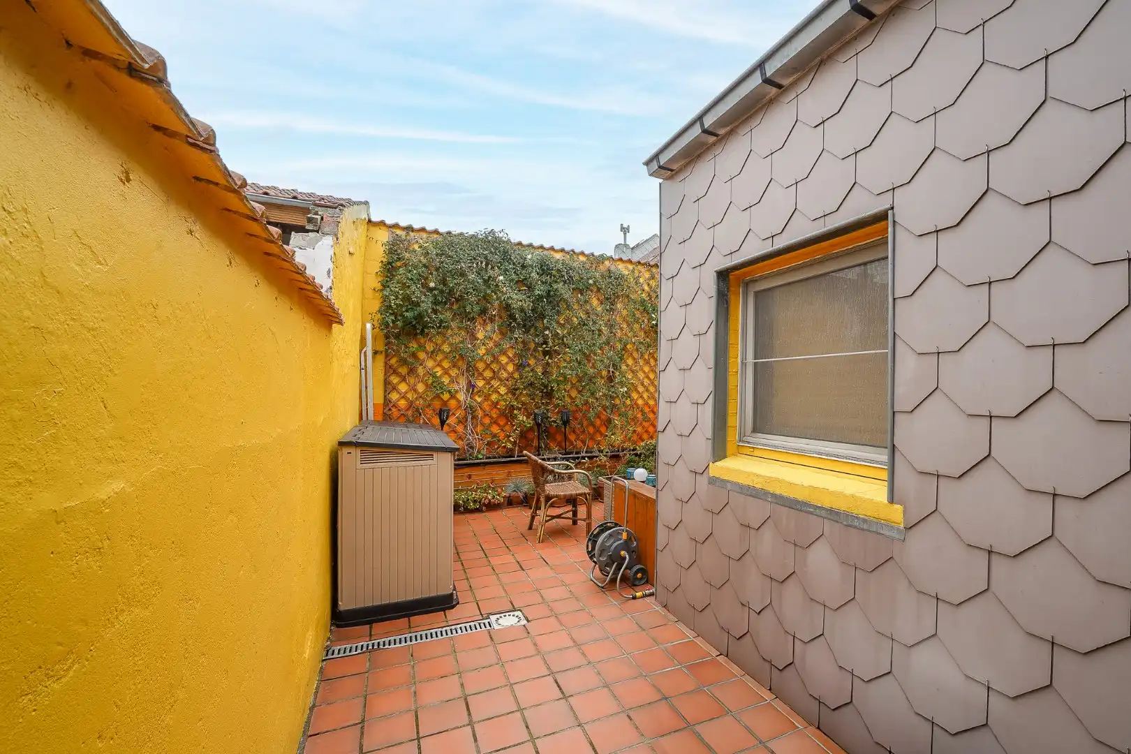 Gesloten woning met 2 slaapkamers en gezellige stadstuin foto 2
