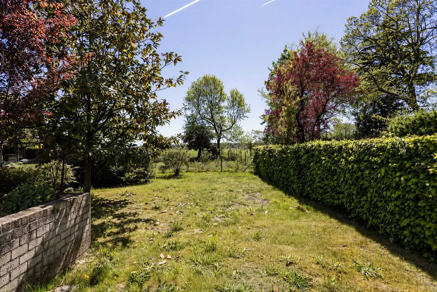Ruime woning met zuidgerichte tuin en open zicht. foto 17