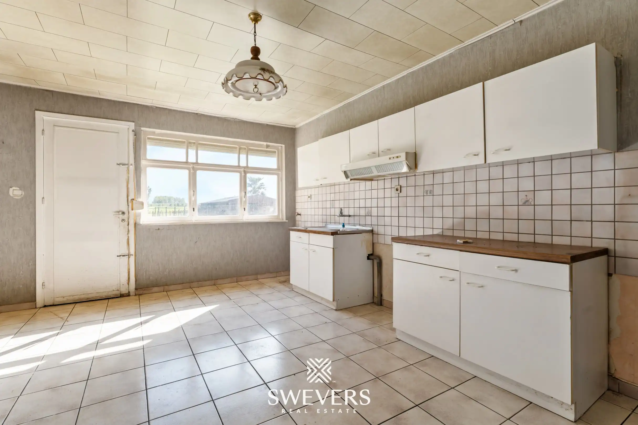 Te renoveren woning met 4 slaapkamers en prachtige tuin in Heers foto 3