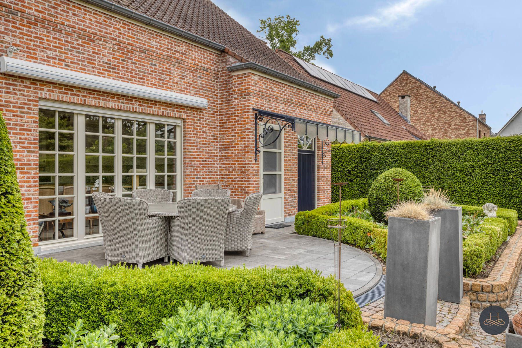 Stijlvolle woning met zorgvuldig aangelegde tuin foto 29