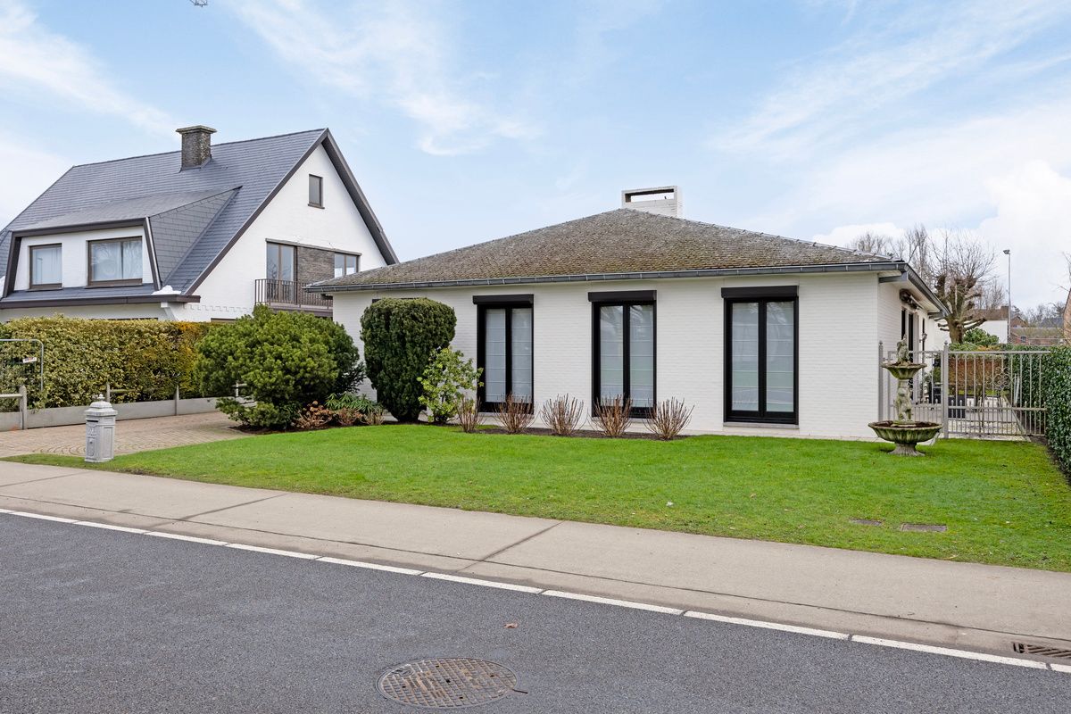 Ruime gelijkvloerse woning met bedrijfshal foto 3