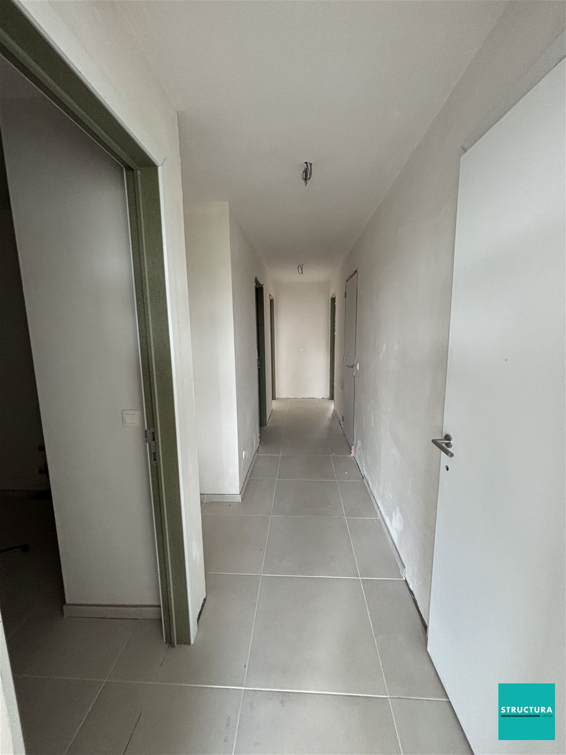 Appartement met 2 slaapkamers en 2 staanplaatsen in centrum Merchtem foto 10