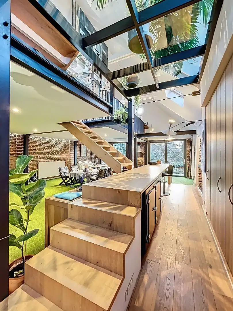 Instapklare loft met veel licht, ruimte en westgerichte tuin foto 12