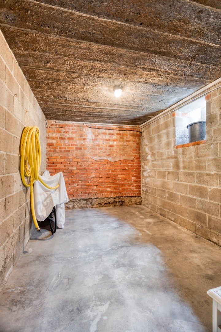 Opbrengsteigendom met 3 appartementen, garages en tuin foto 27