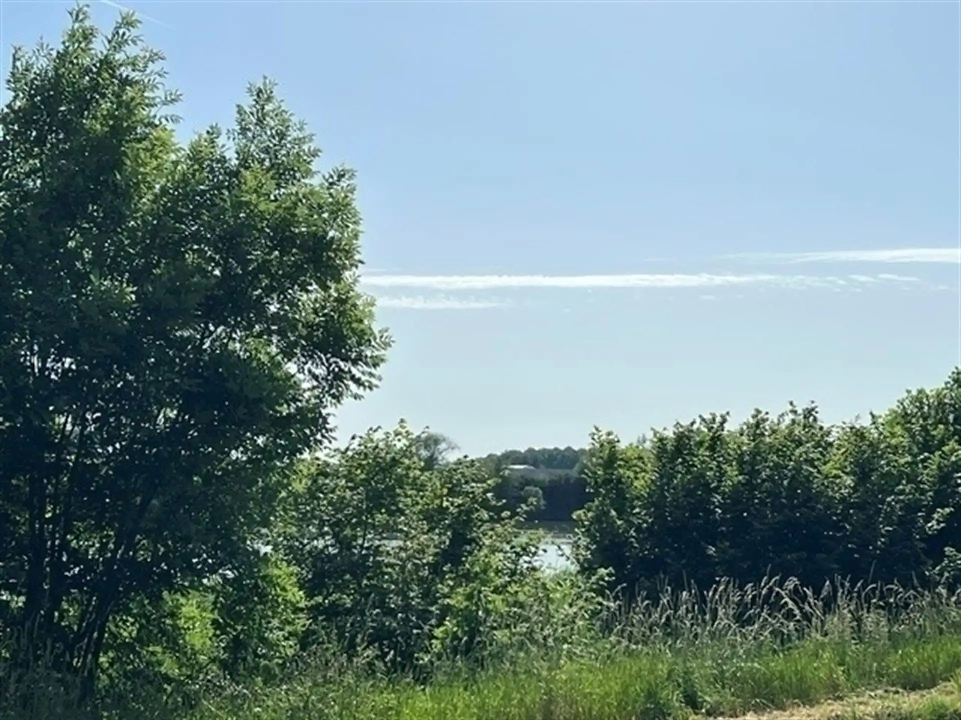 Instapklaar gelijkvloers appartement met zonnige tuin en uniek zicht op het water! foto 9