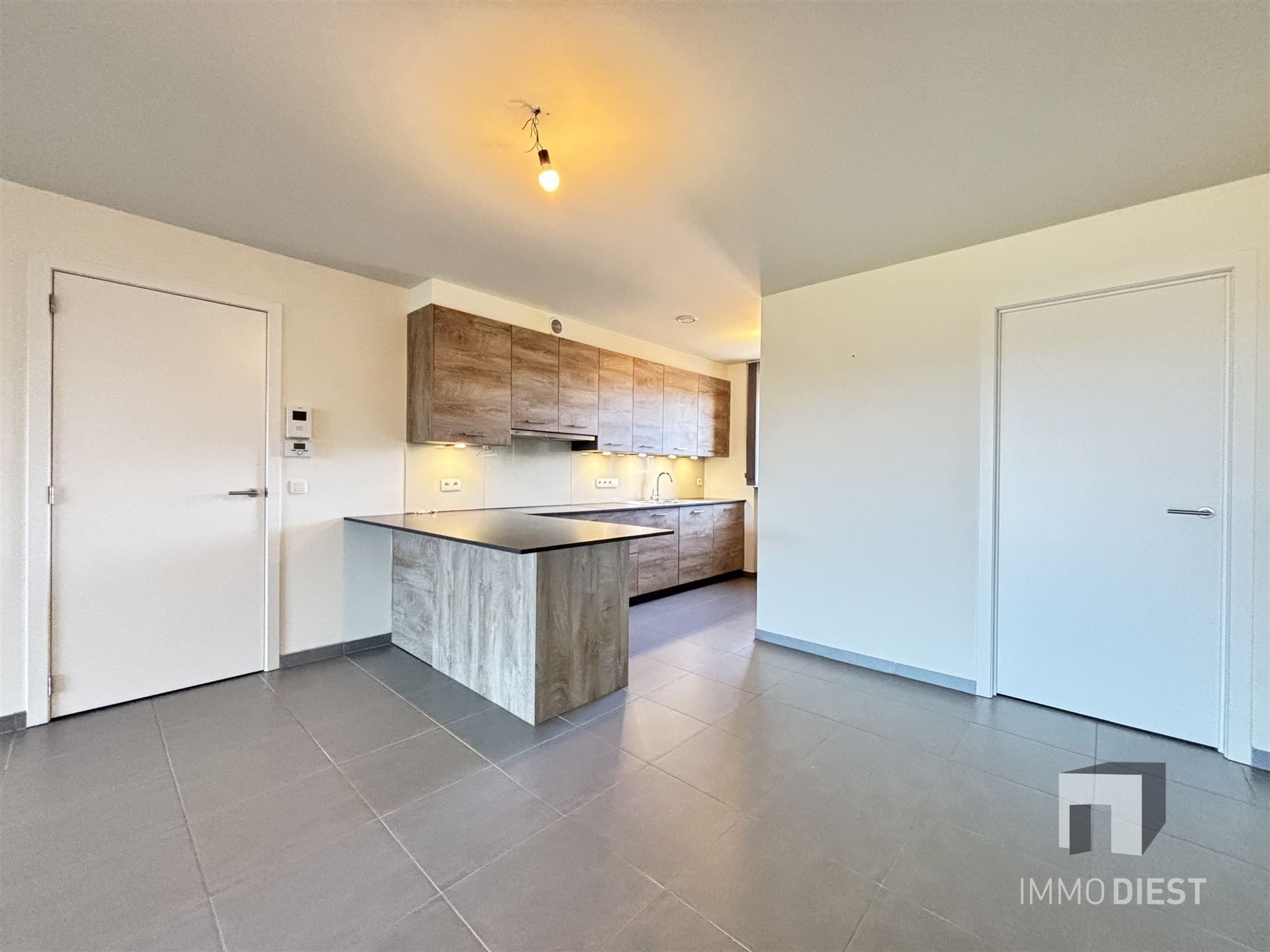 Ruim appartement op de tweede verdieping in het centrum van Tessenderlo foto 7