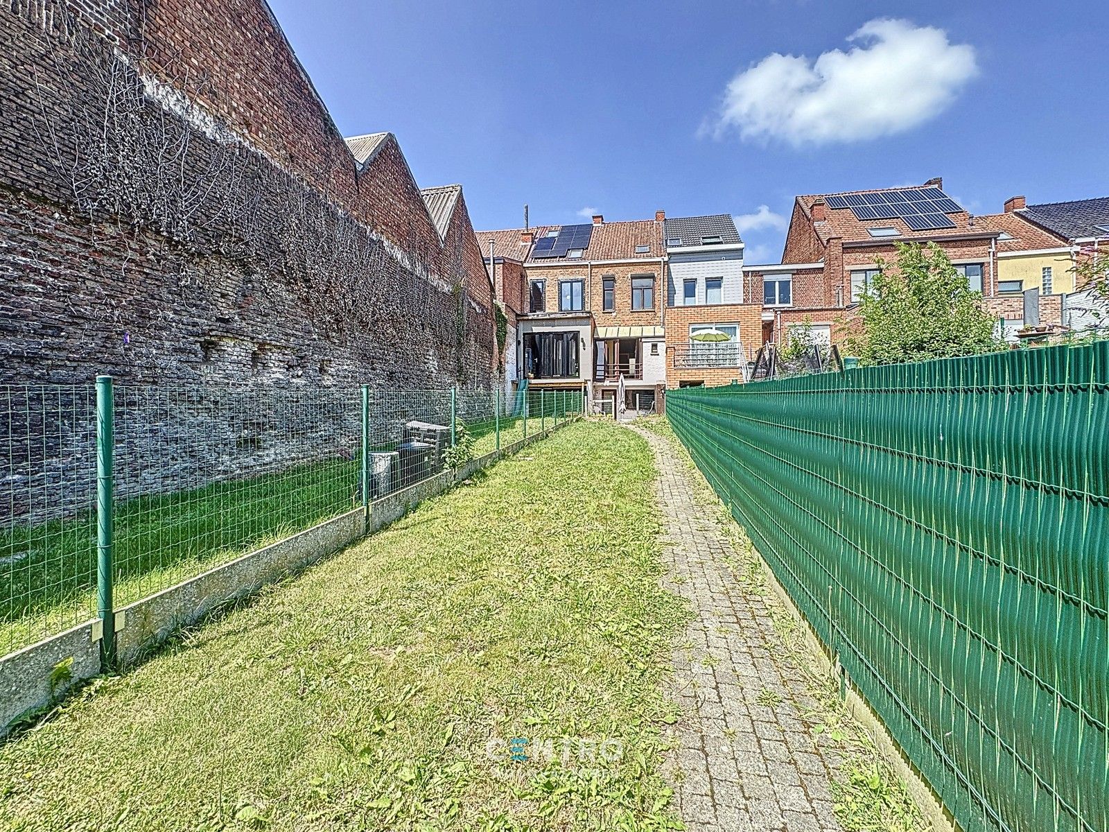 Ruime woning met 3 slpks met grote tuin en UITWEG ACHTERAAN! foto 2