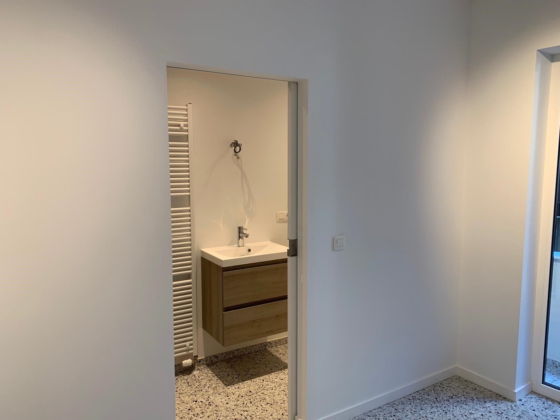 Gerenoveerd éénslaapkamerappartement centrum Oostende foto 12