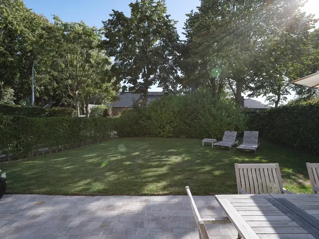 Knap gerenoveerde bungalow (EPC B) op een zuidgericht perceel in het gegeerde Baarle-Drongen foto 2