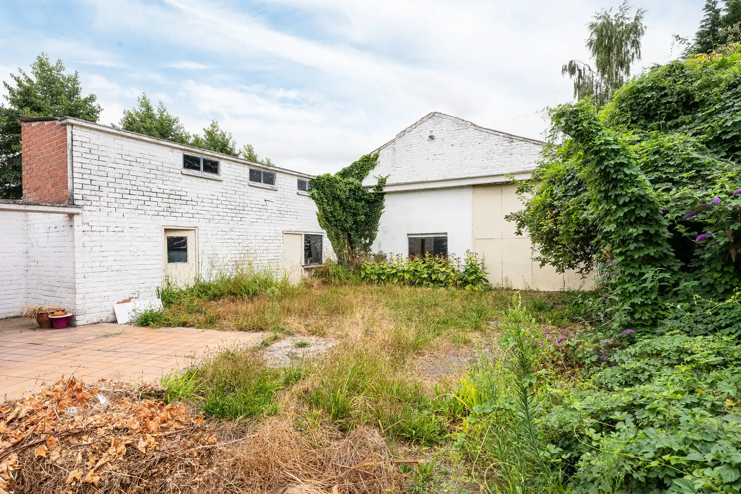 Ruime gezinswoning te koop in Eeklo met 3 slaapkamers met een ruime loods achteraan, die perfect voor een combinatie van comfortabel wonen en werken kan zijn. foto 20