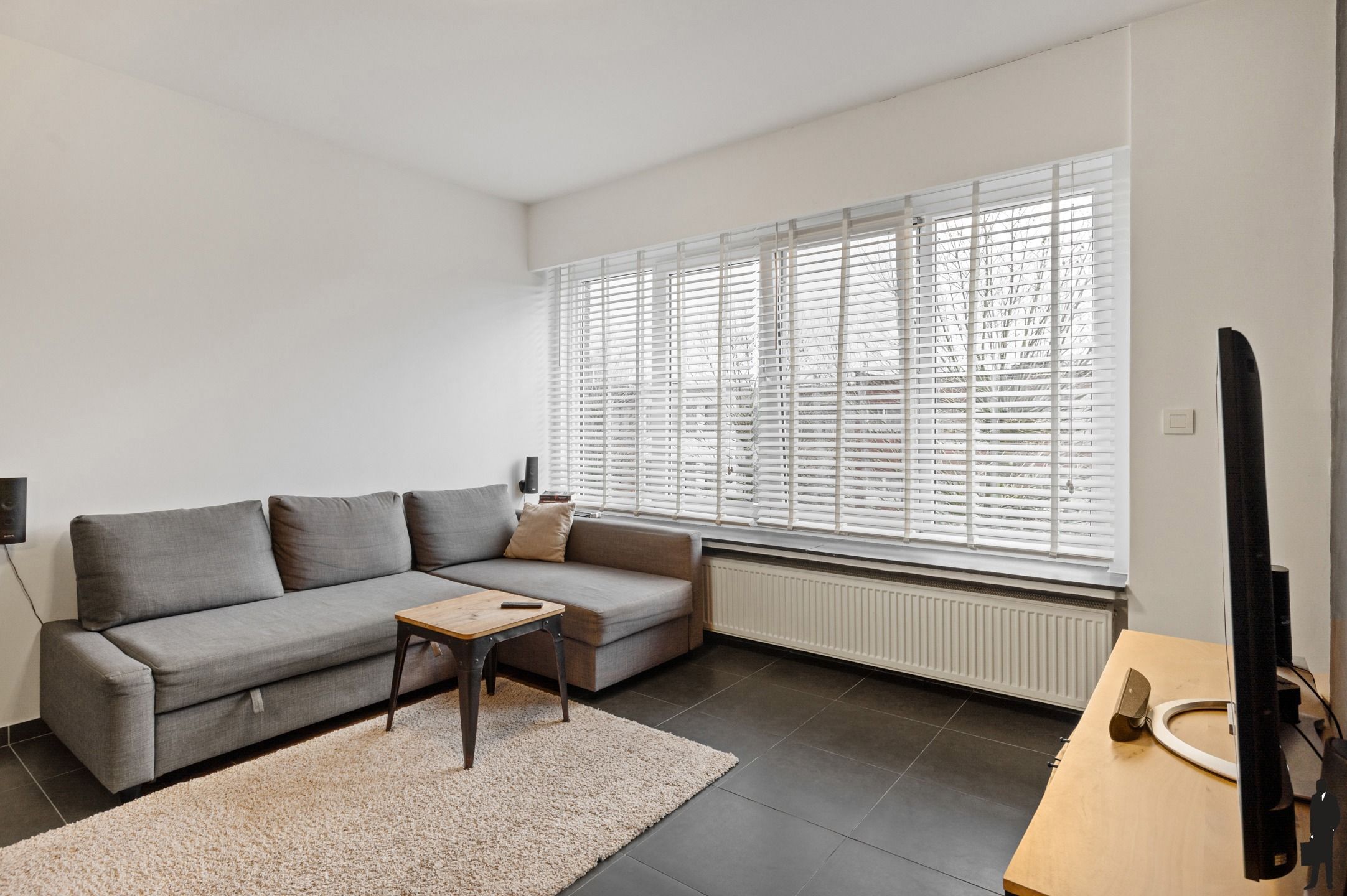 Instapklaar appartement met terrasje in Borsbeek foto 5