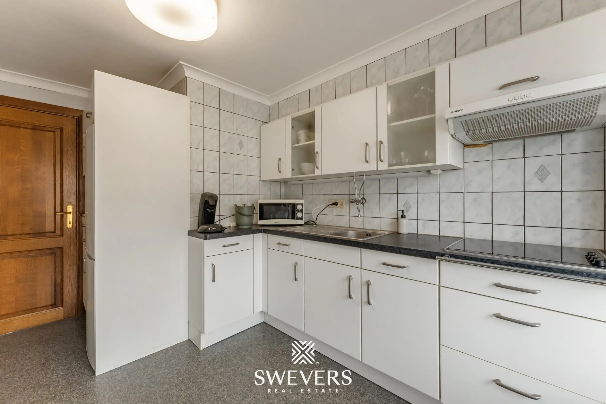 Ruim en lichtrijk 3-slpk appartement met 2 terrasjes in hartje Genk foto 8