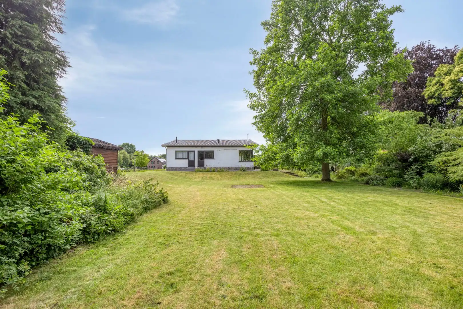 Gelijkvloerse woning met 3 slpks op een uniek perceel van 2.164 m² nabij de Markt !  foto 24