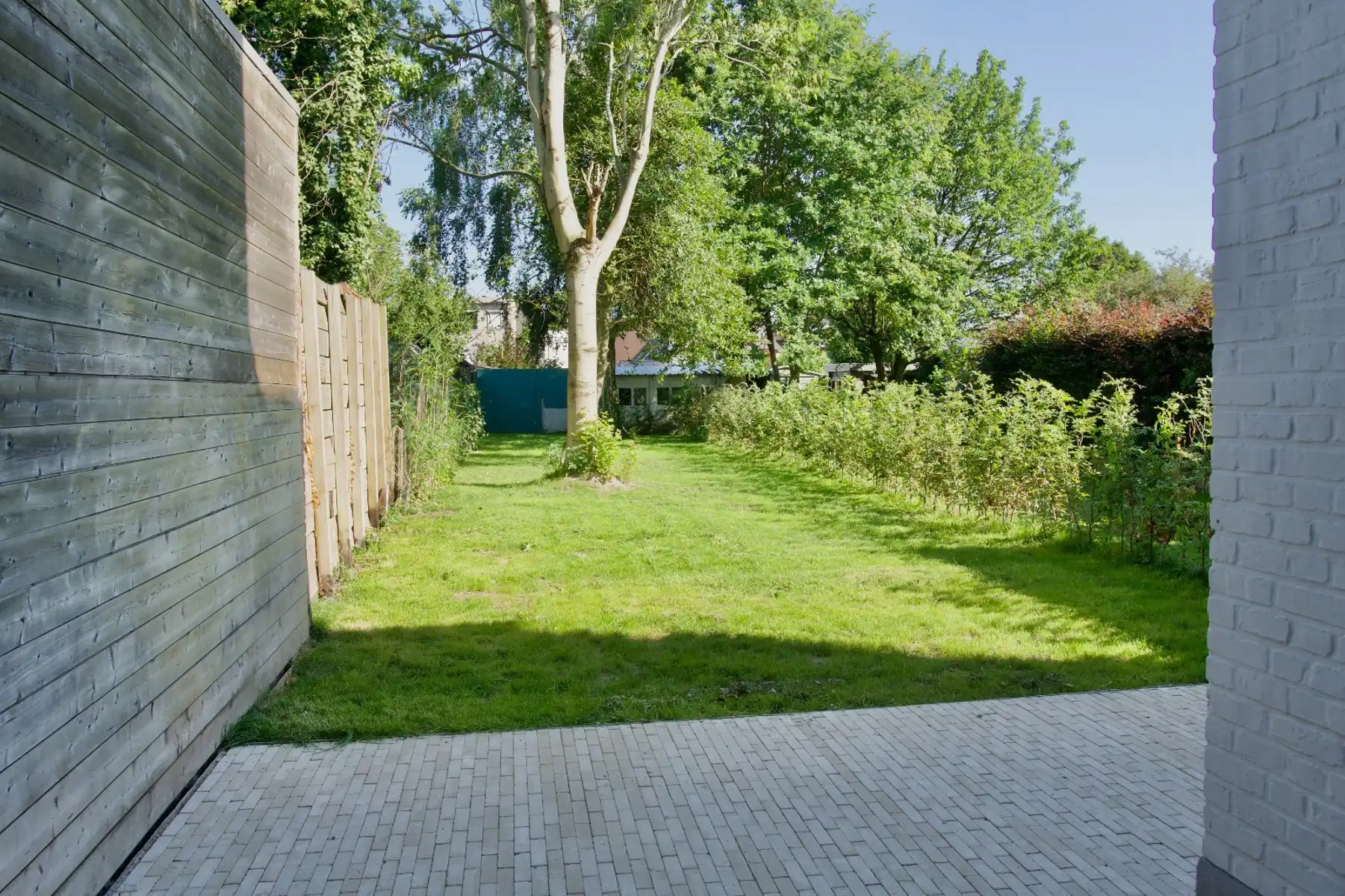 Opbrengsteigendom met 3 appartementen, tuin en garagebox foto 28