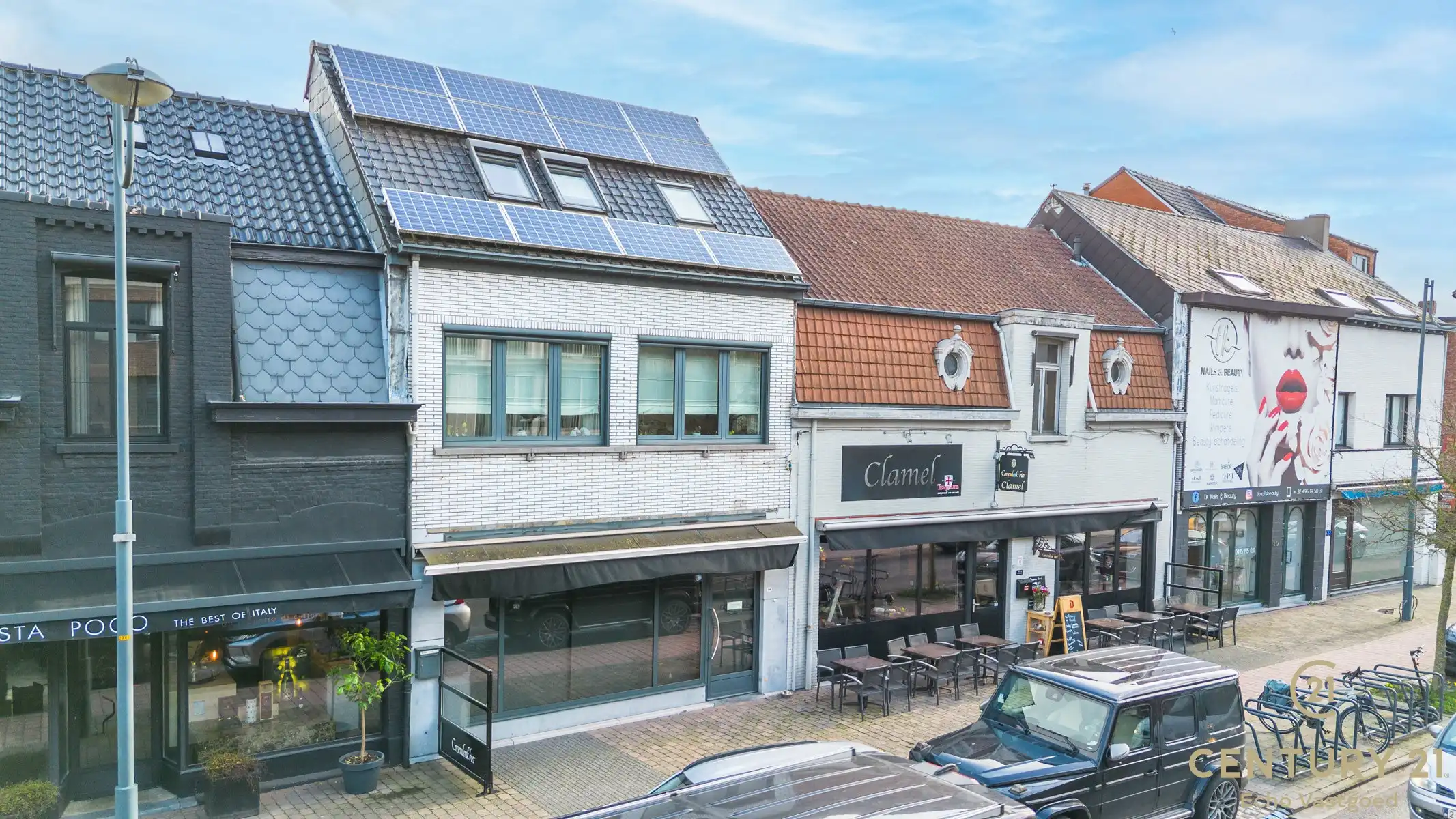 Handelszaak met gerenoveerde woonst op topligging  foto 24