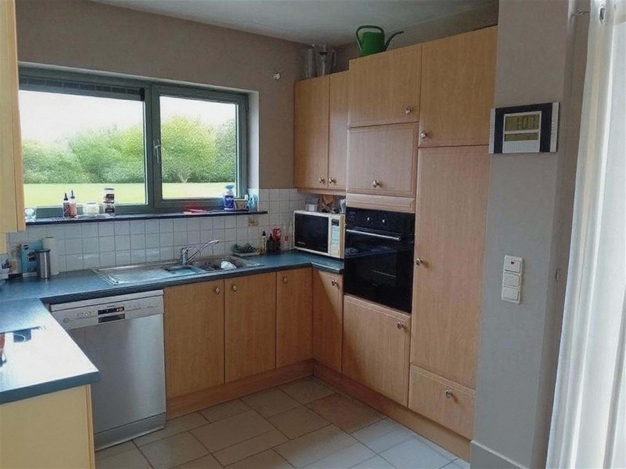 Rustig gelegen woning met 3 slaapkamers, garage en aangename tuin foto 4