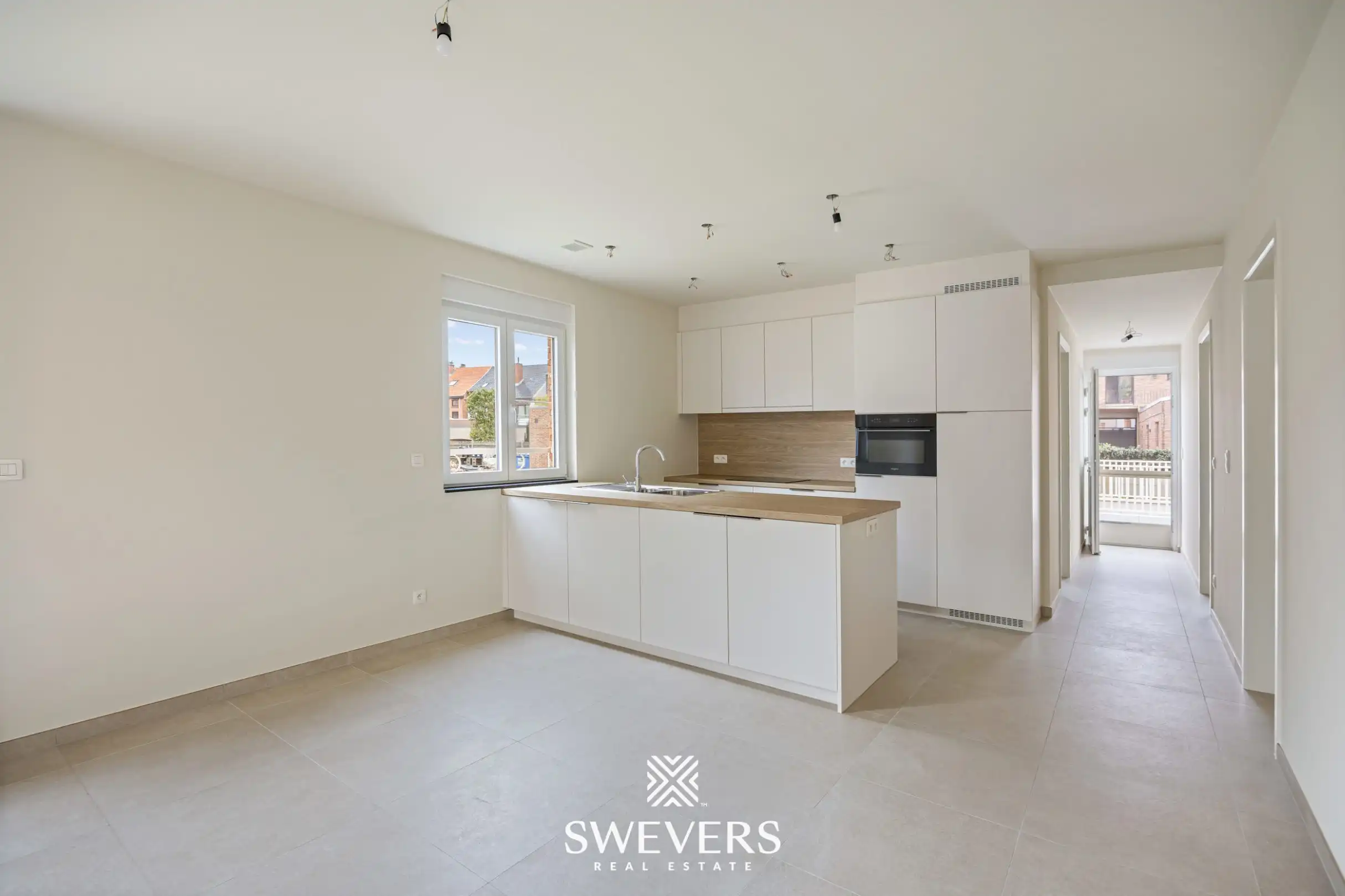 Modern gelijkvloers appartement met privétuin en dubbele parking foto 4