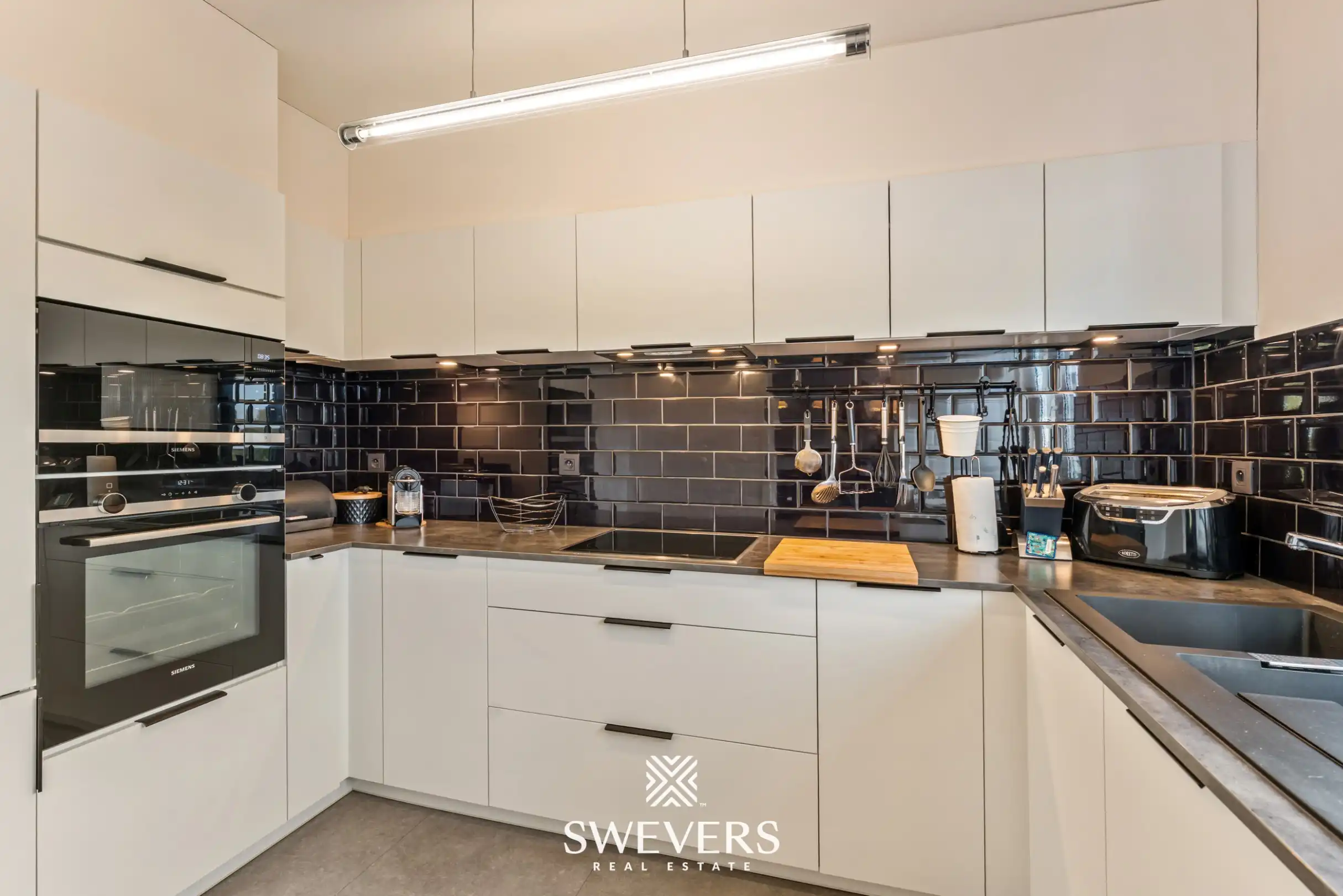 Gerenoveerd appartement met garagebox en kelderberging foto 7