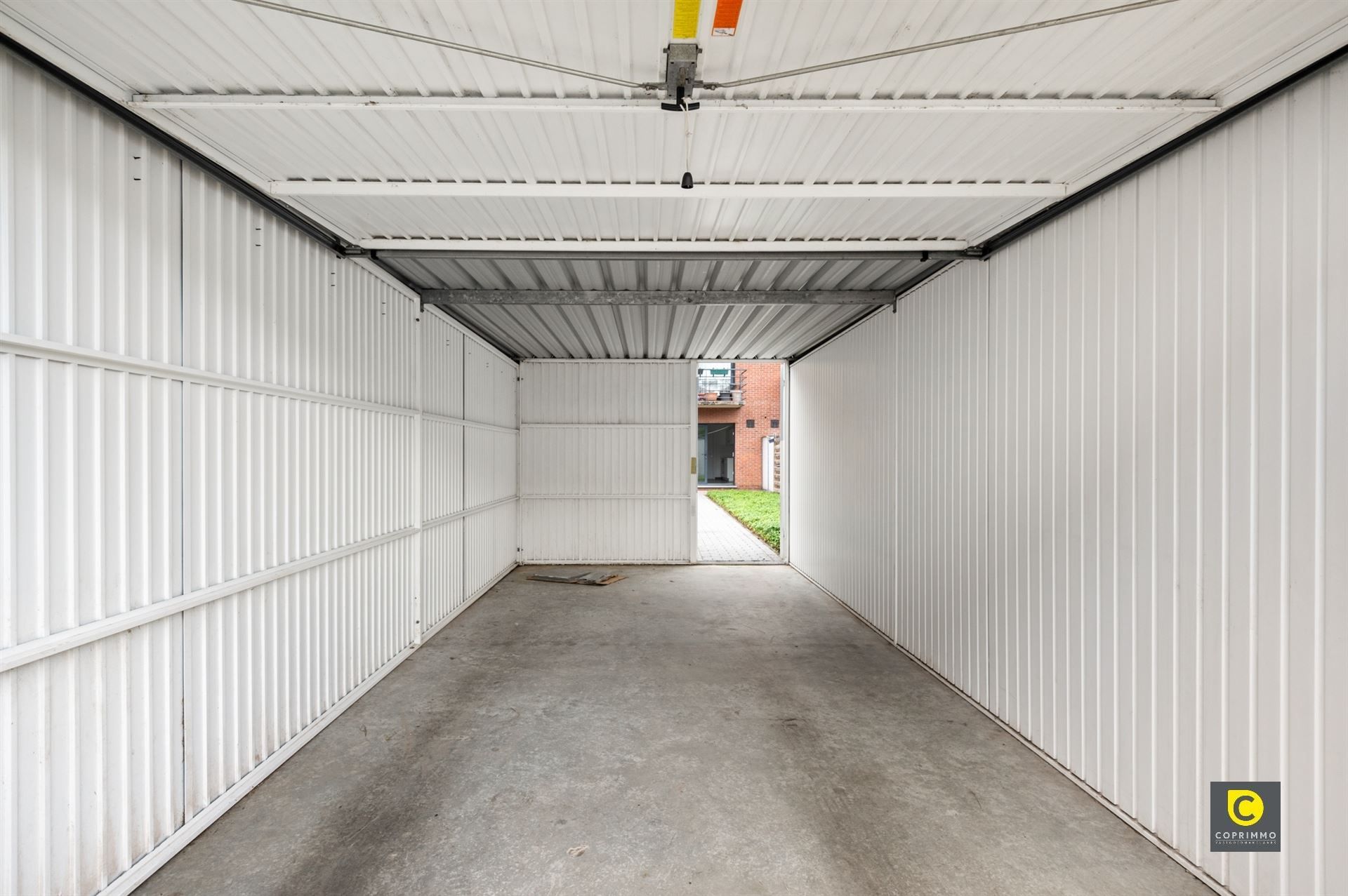Gelijkvloers app met 2 slpk, tuin en garagebox foto 11