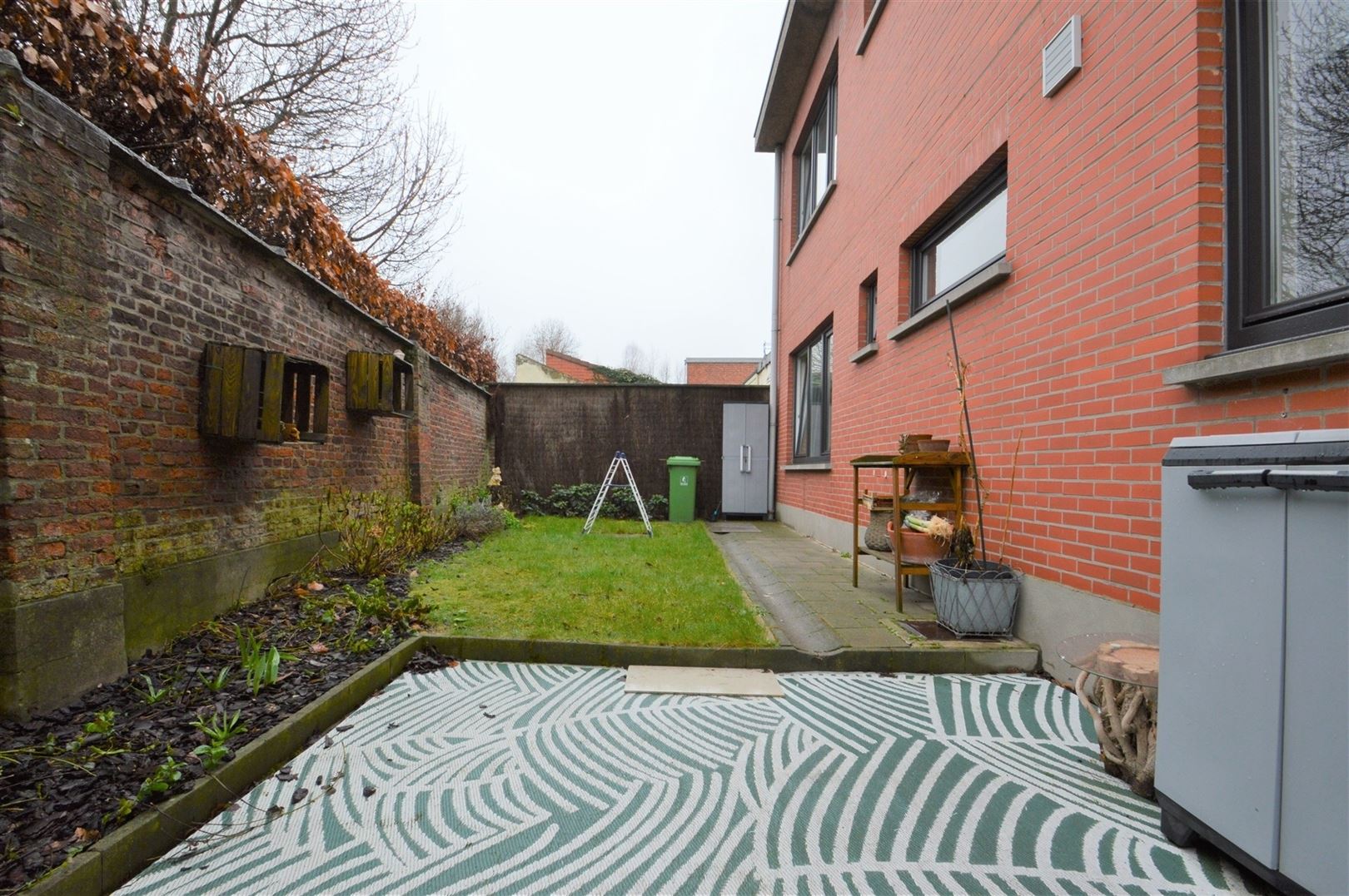 Totaal gerenoveerd GV appartement met tuin te Grembergen foto 11