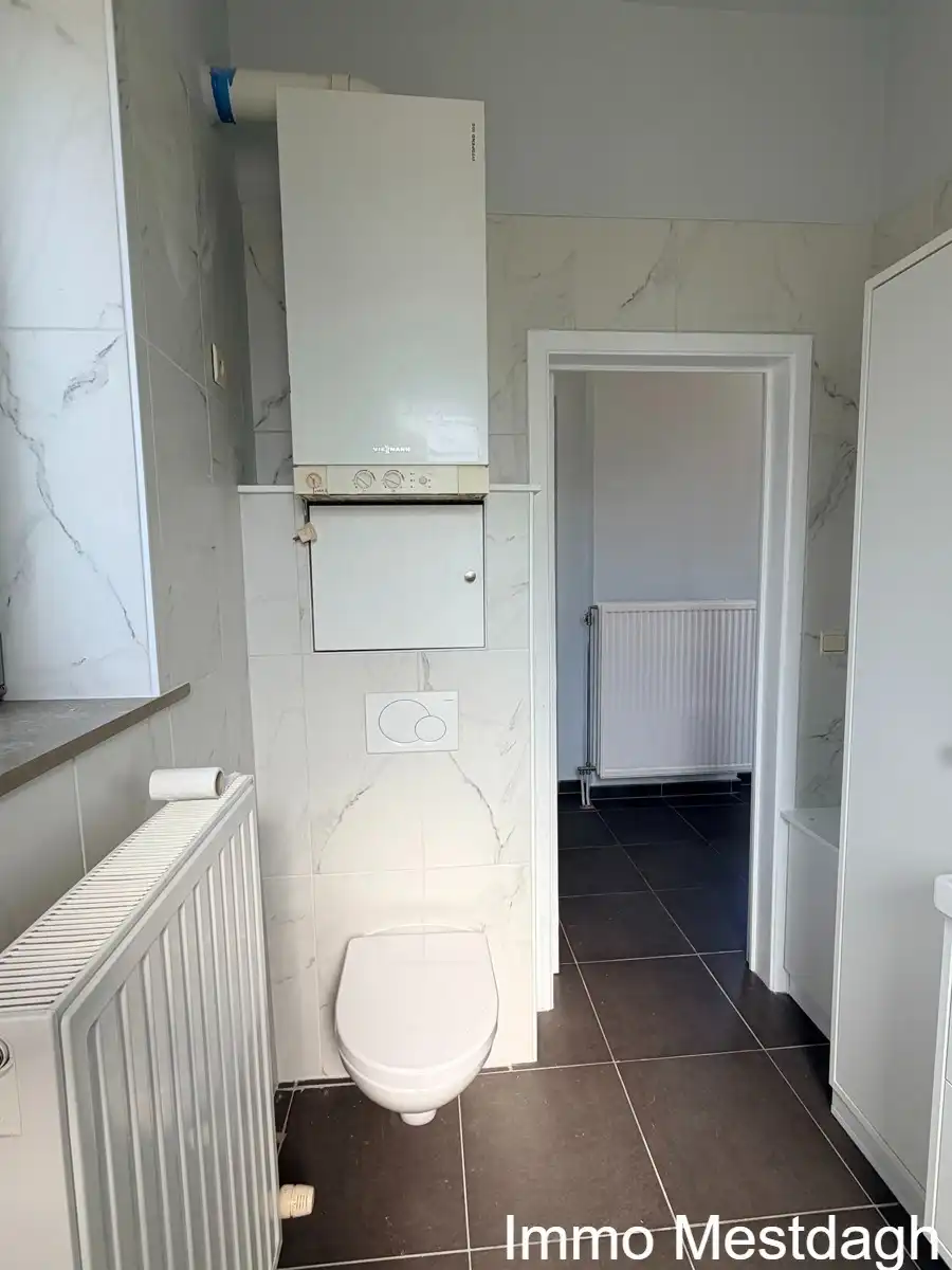 Prachtig gerenoveerd gelijkvloers appartement met terras en tuin in centrum Rummen foto 13