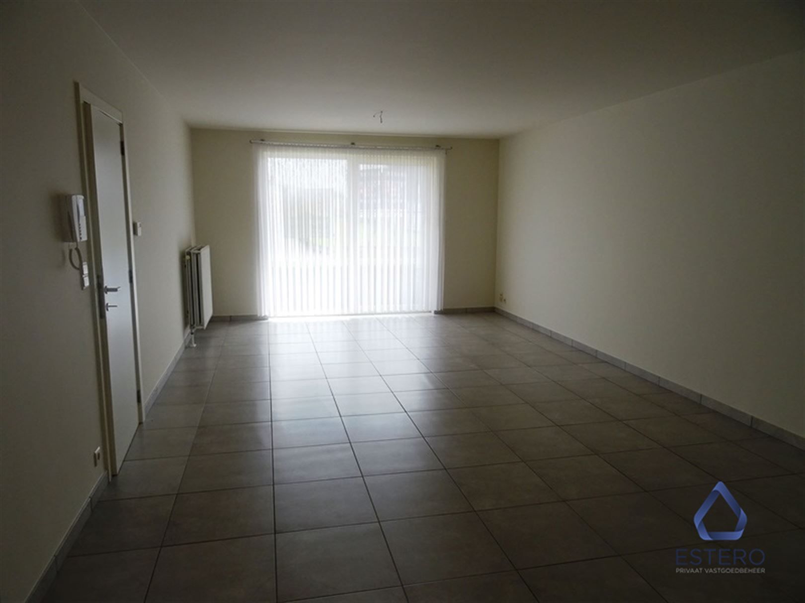 Leuk gelijkvloers appartement met groot terras, aangelegd tuintje en garagebox foto 4