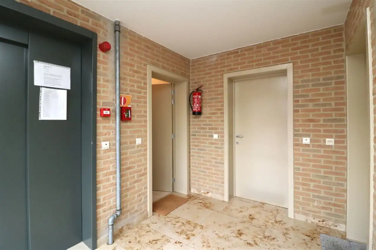 Ruim gelijkvloers wonen met tuin én rendement. foto 24