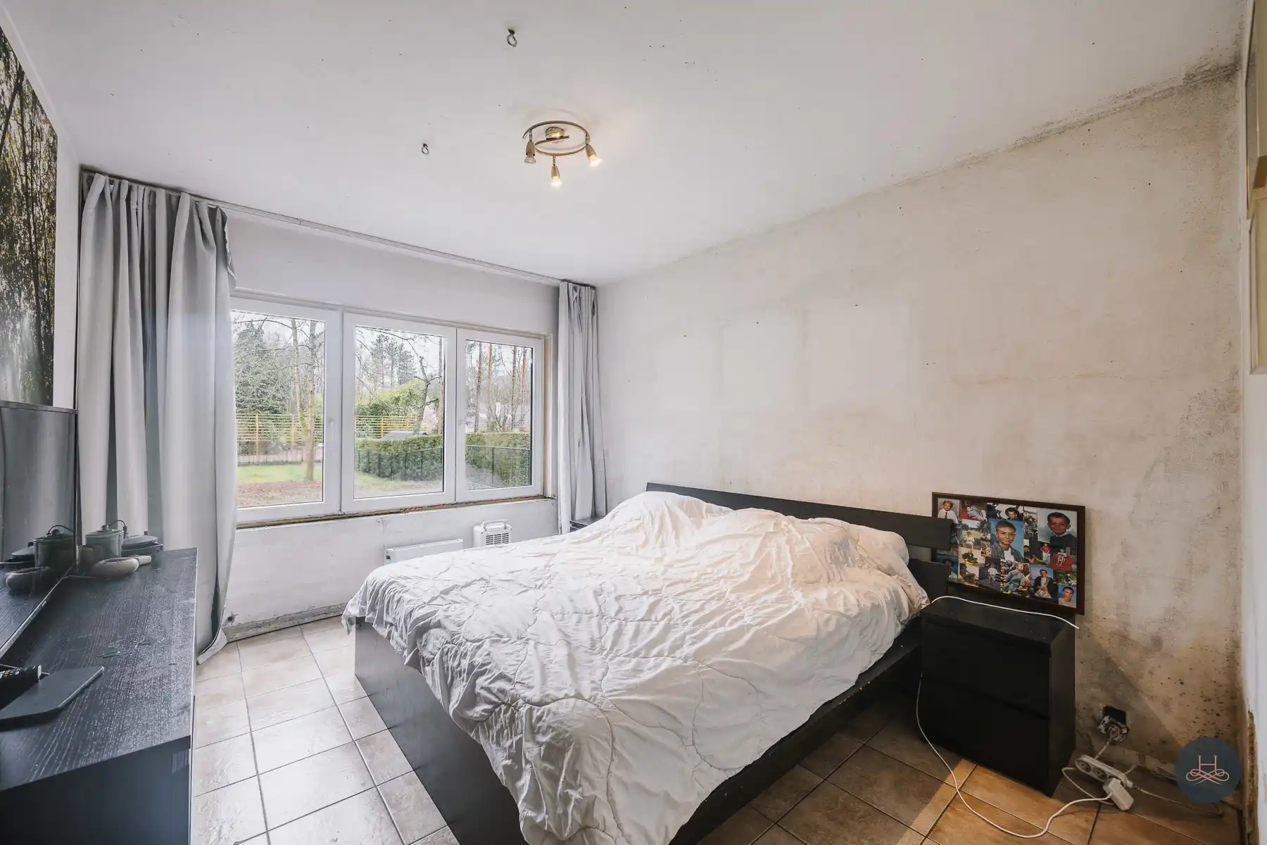 Gezinswoning met renovatiepotentieel op knap perceel foto 16