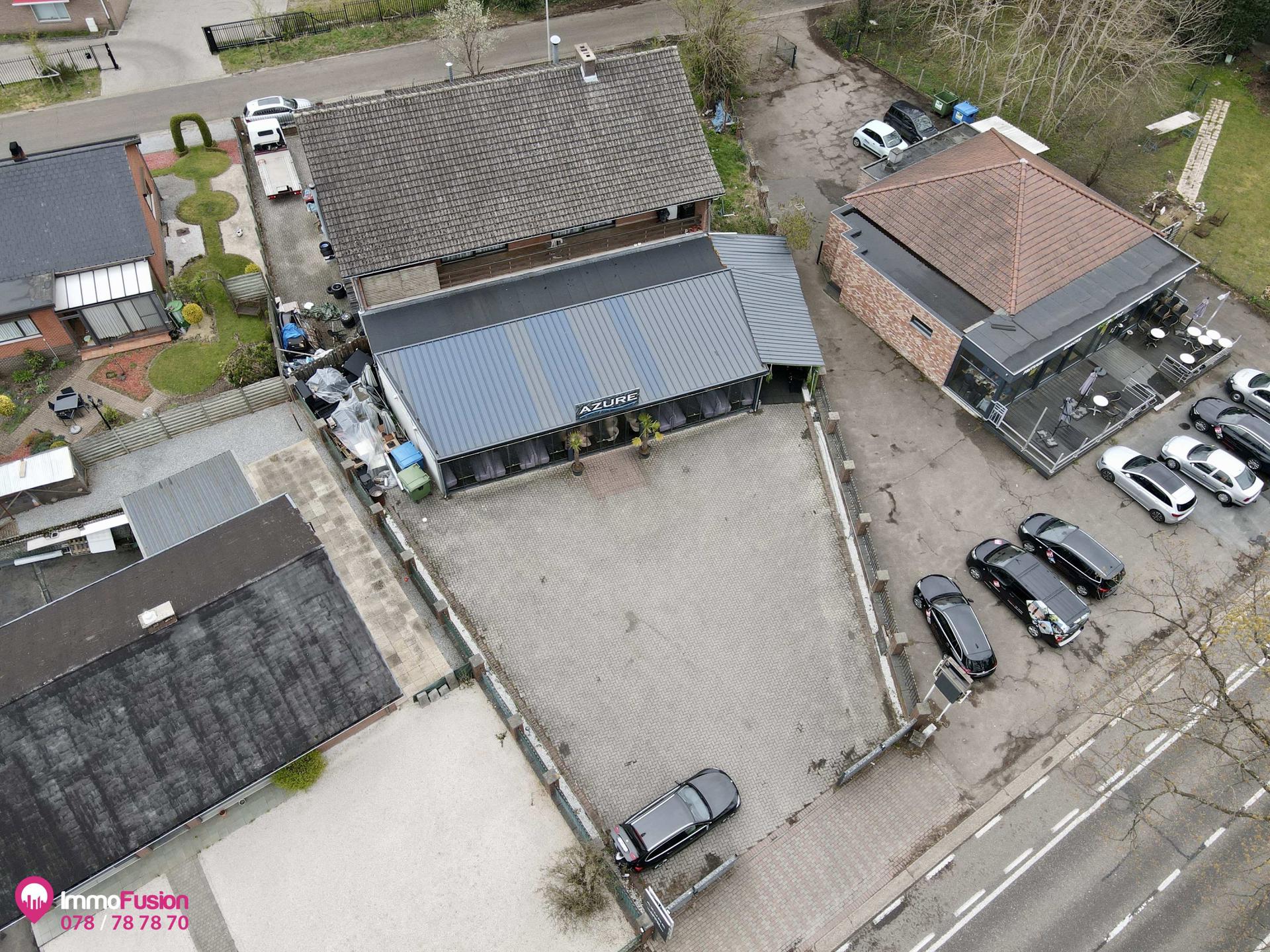 Riant handelspand met woonst en grote parking op toplocatie! foto 43