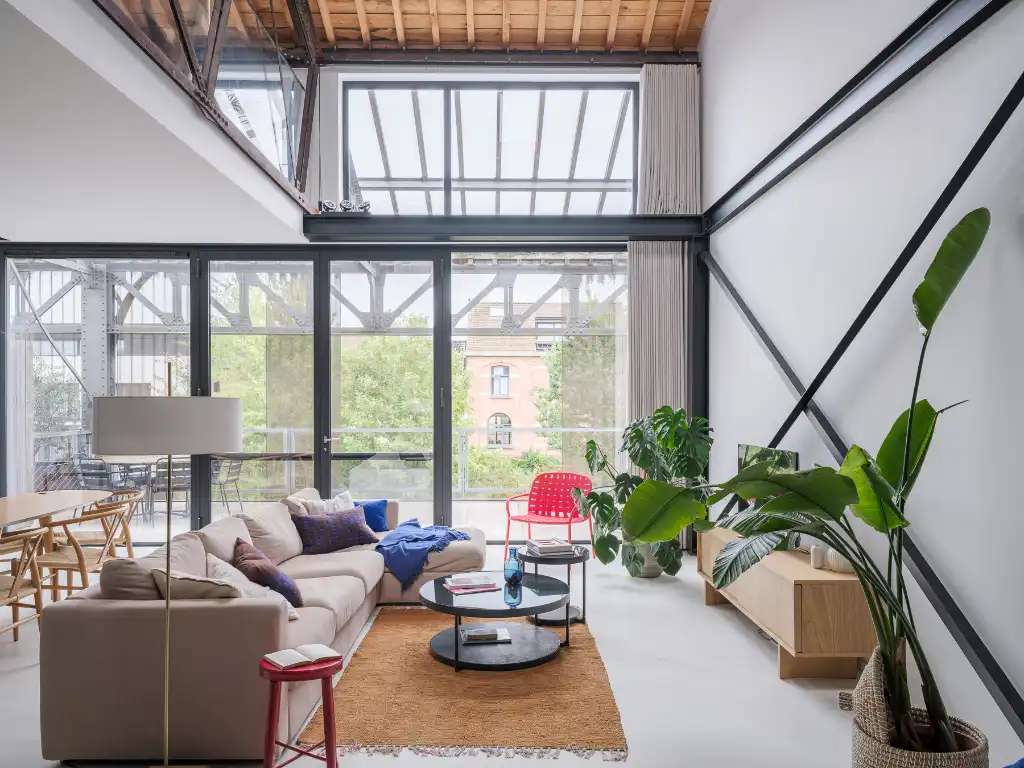 Luxueus en tijdloos – Exceptionele loft met 2 slaapkamers, aparte bureauruimte en ruim terras in een beschermd gebouw met een rijke industriële voorgeschiedenis. foto 5