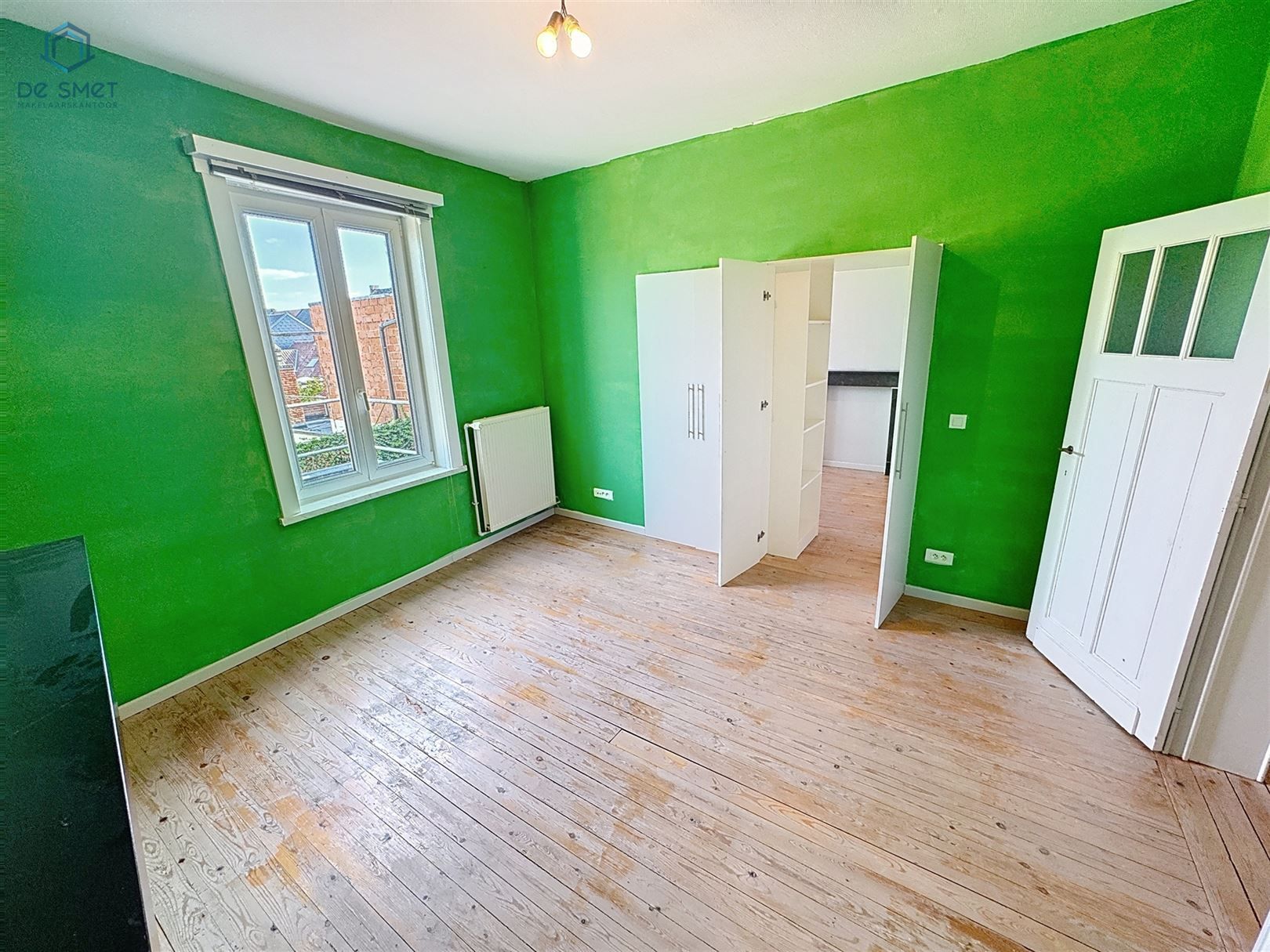 Instapklaar herenhuis met 3 slaapkamers, garage en royaal terras in het hart van Meerbeke foto 17