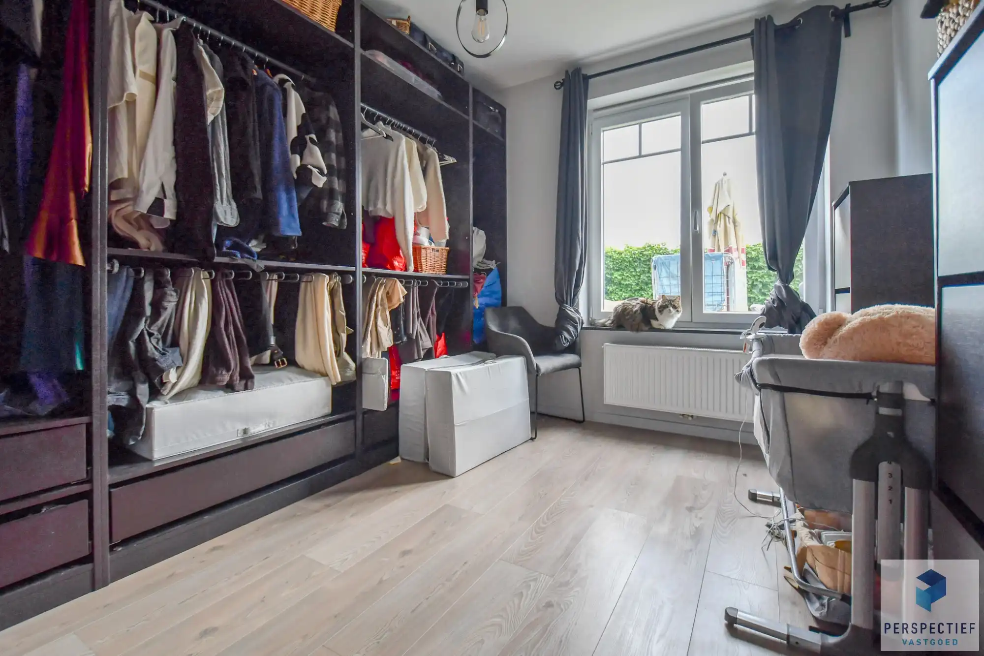 Ruim gelijkvloers appartement met 2 slaapkamers, voor- én achtertuin met terras & mogelijkheid tot aankoop staanplaats foto 13
