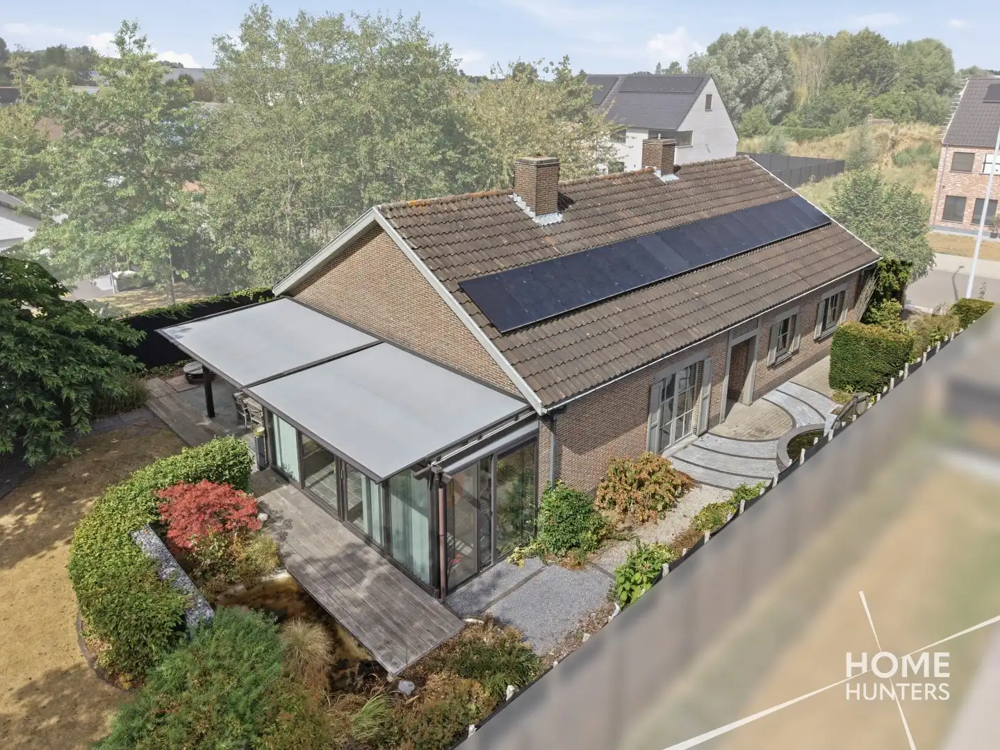 Alleenstaande woning met prachtige tuin en tal van extra troeven in een rustige wijk te Wervik foto 2