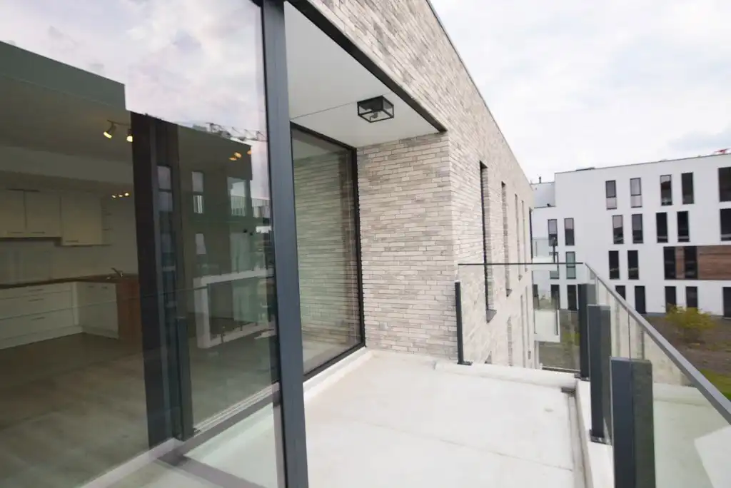 Modern, energiezuinig appartement met 2 slpks, terras, autostaanplaats en kelderberging. foto 11