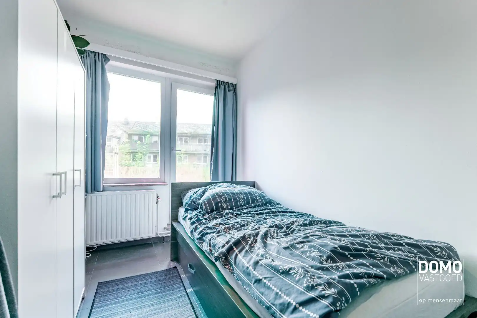 RUIM APPARTEMENT MET 2 SLAAPKAMERS, 2 ZOLDERKAMERS EN 2 GARAGES TE RUNKST foto 11