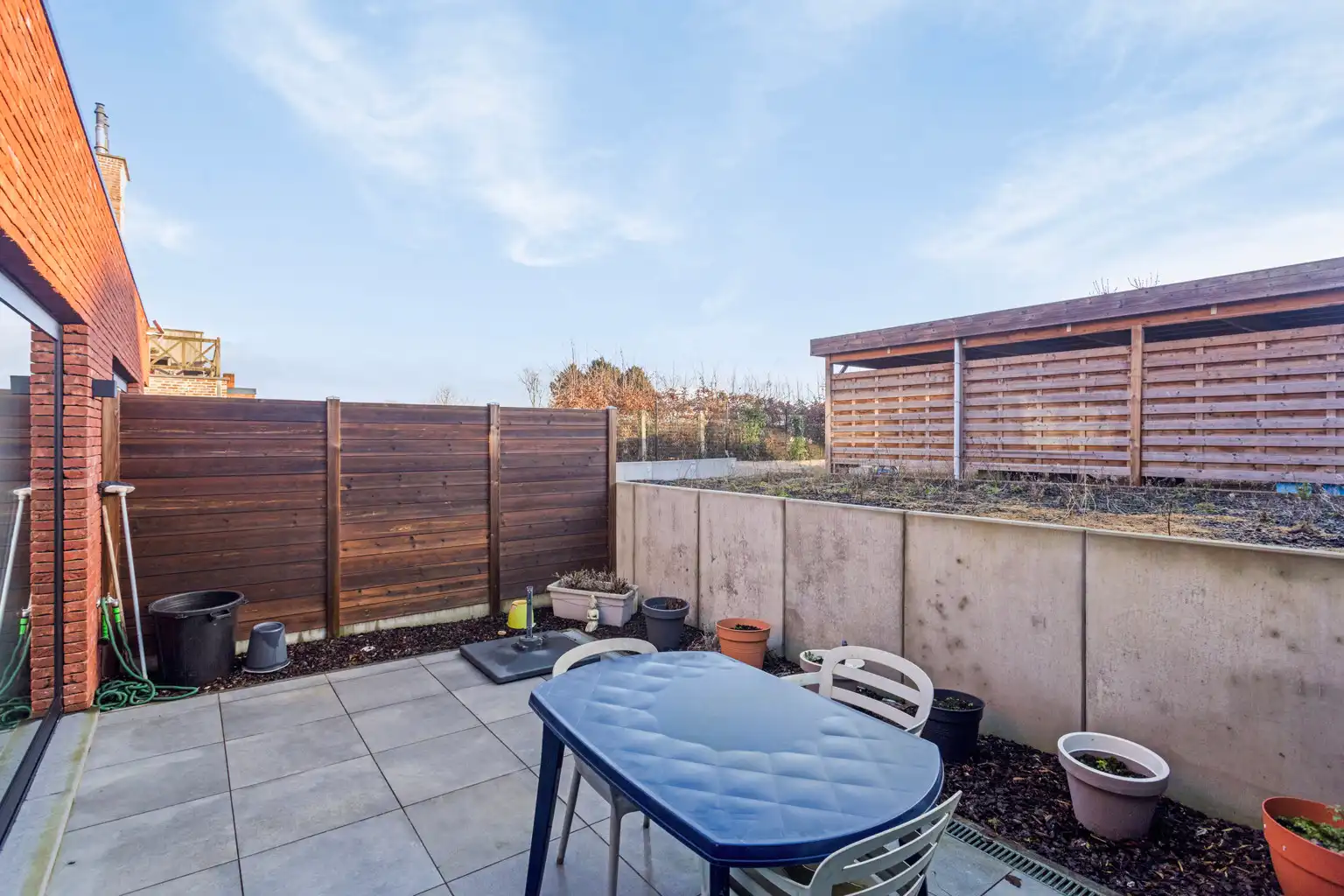 Gelijkvloersapp. in uitstekende staat met 2 slpks en carport foto 13