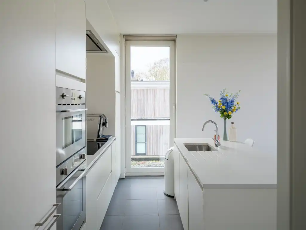 Lichtrijke penthouse met 3 slaapkamers, ruim zonneterras en twee overdekte staanplaatsen met groen uitzicht op fietsafstand van het centrum van Gent. foto 7