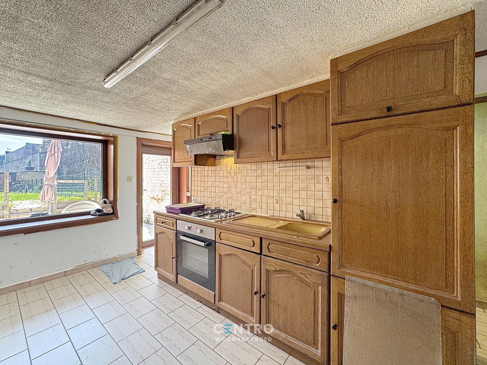 Ruime woning met 3 slpks met grote tuin en UITWEG ACHTERAAN! foto 6