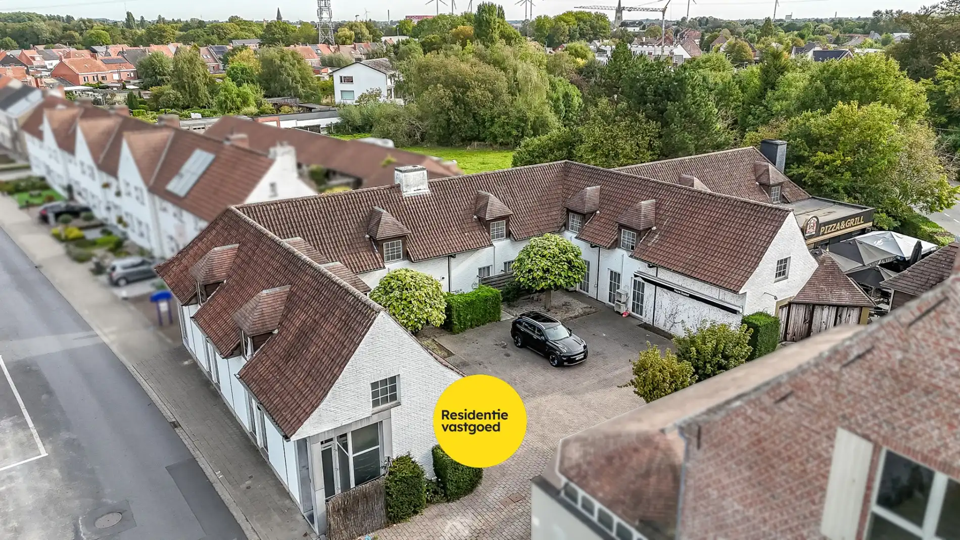 Multifunctionele eigendom met appartementen en handelszaken! foto 2