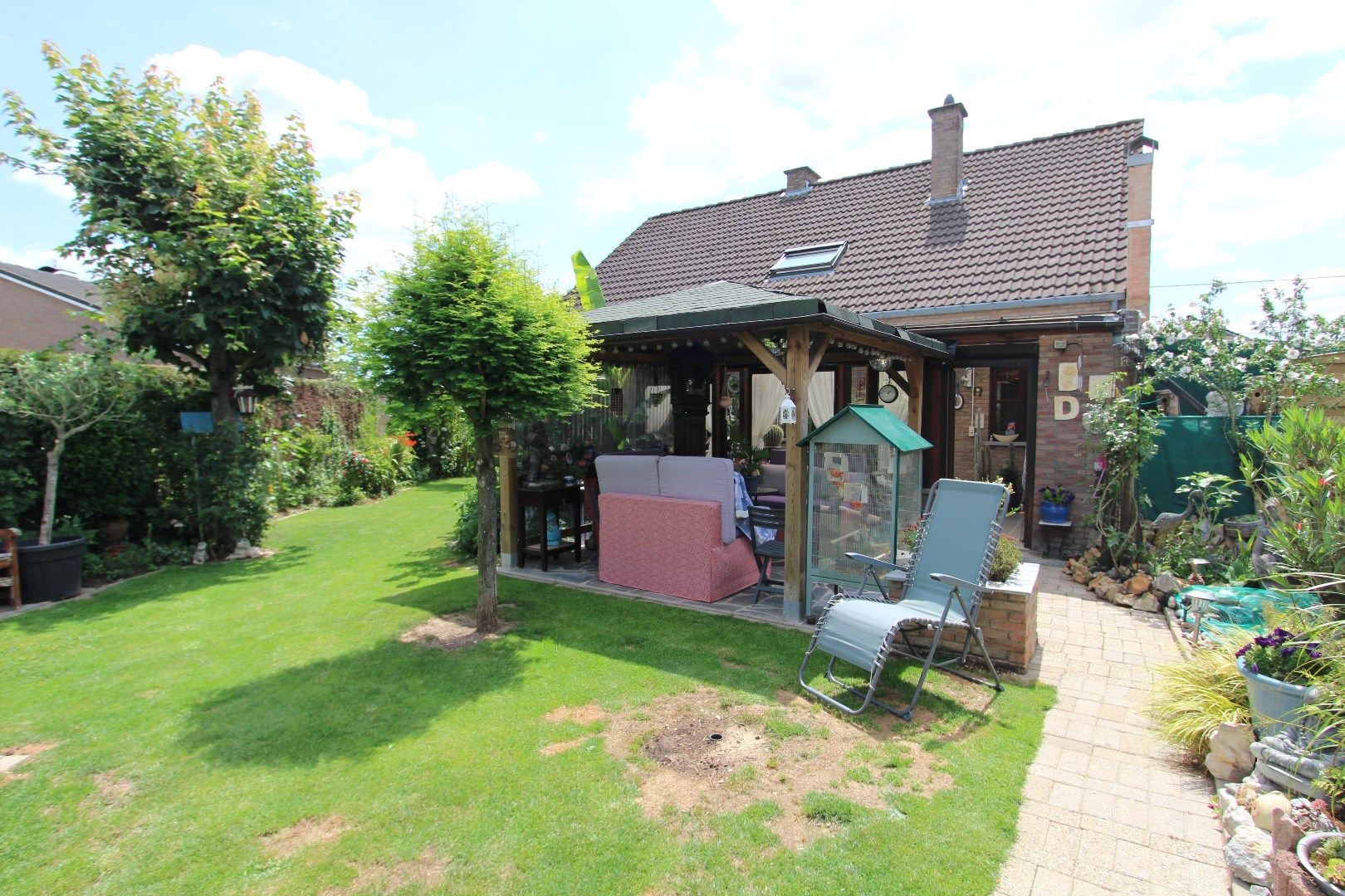 Charmante woning met veranda en mooie tuin in een rustige, landelijke omgeving foto 22