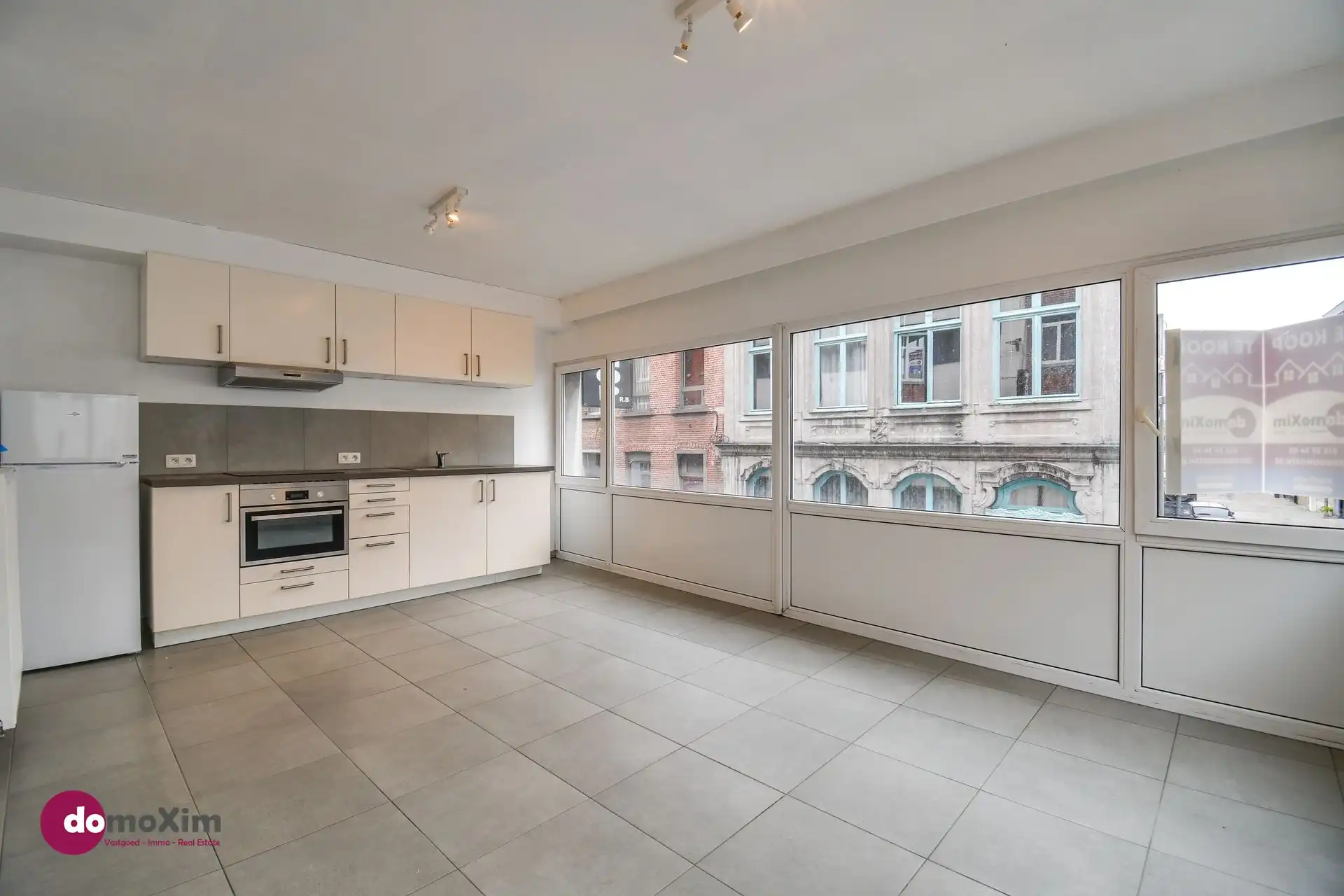 Opbrengsteigendom met 3 appartementen en handelsruimte in het centrum van Mechelen foto 2