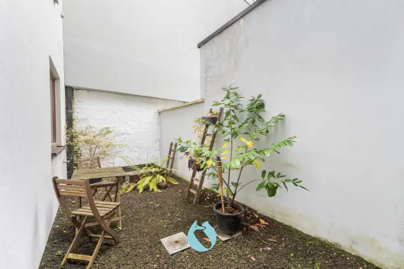 Instapklare stadswoning met 2 slaapkamers, bureauruimte en tuin foto 5