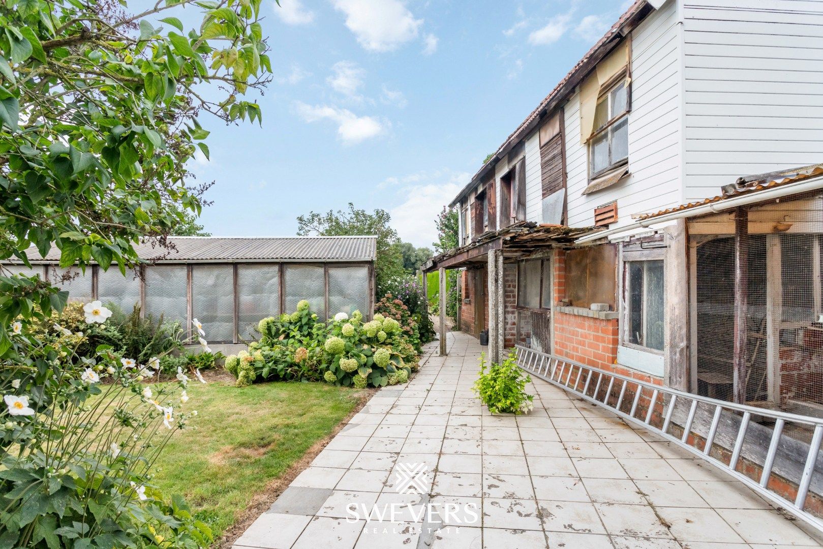 Te renoveren woning met grote tuin in hartje Wellen foto 23