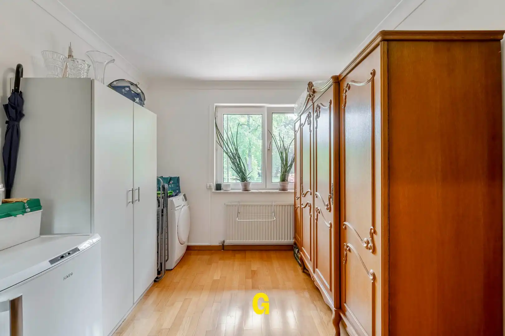 Uitstekend verzorgd 2-slaapkamer appartement in hartje Bilzen, met standplaats, kelderberging en terras met zicht op het Park van Haffmans foto 23