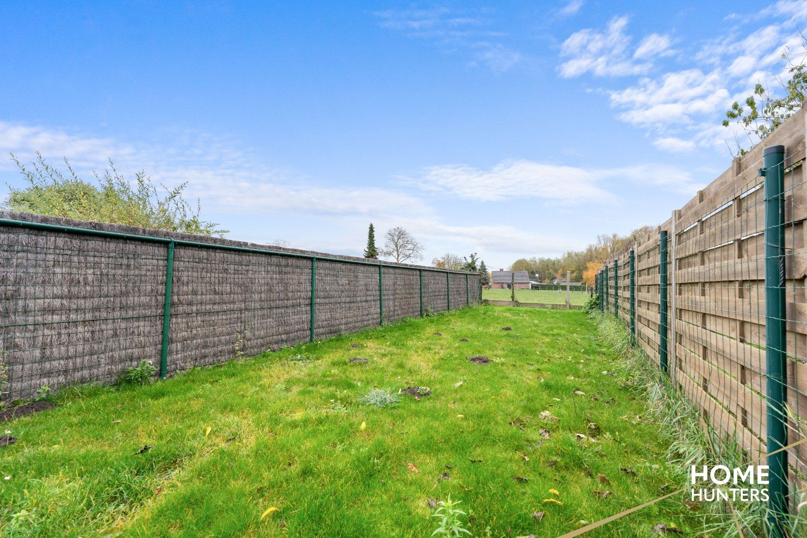 Charmante te renoveren rijwoning met 3 slaapkamers en diepe tuin op centrale ligging in Menen foto 24