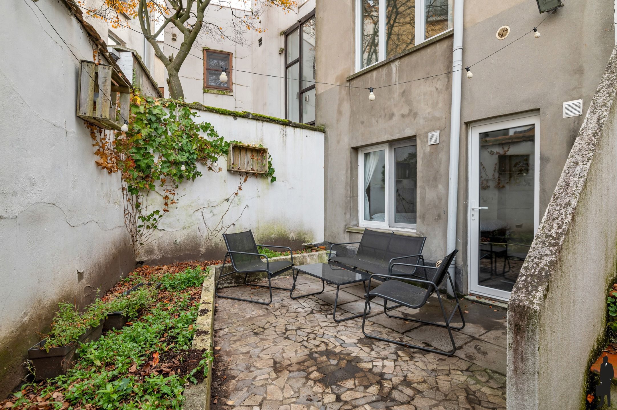 Lichtrijke duplex met tuin in Zurenborg foto 18