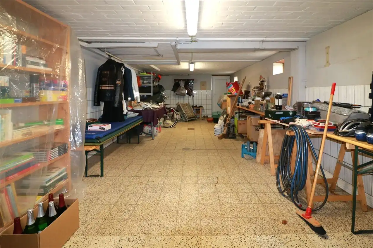 Gusting gelegen woning met 2 slpk, garage en tuin foto 23