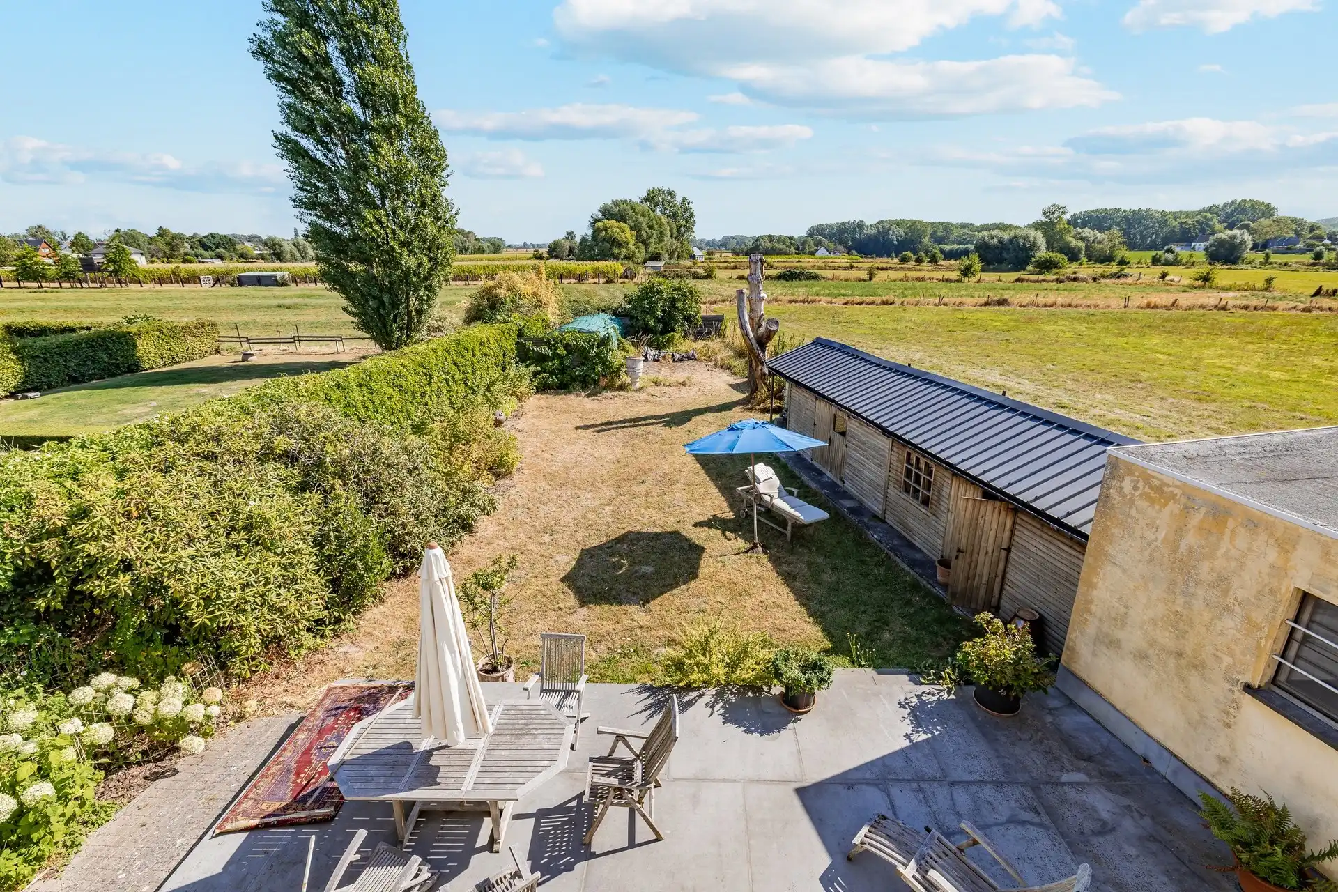 Zeer ruime woning met twee wooneenheden en prachtig landelijk uitzicht foto 14