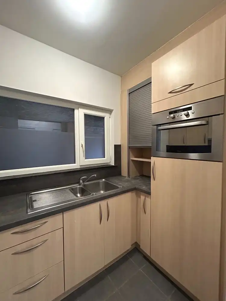 Instapklaar gelijkvloers 1-slaapkamerappartement met ruim terras in Leuven foto 8