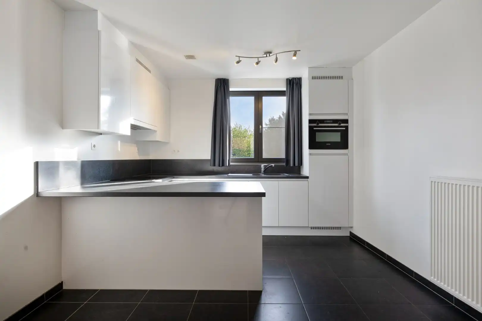 Recent appartement met 2 slaapkamers, terras, 2 ondergrondse autostaanplaatsen en private kelderberging in Herent! - EPC 41 kWh/m² - bewoonbare opp. 86 m² foto 8